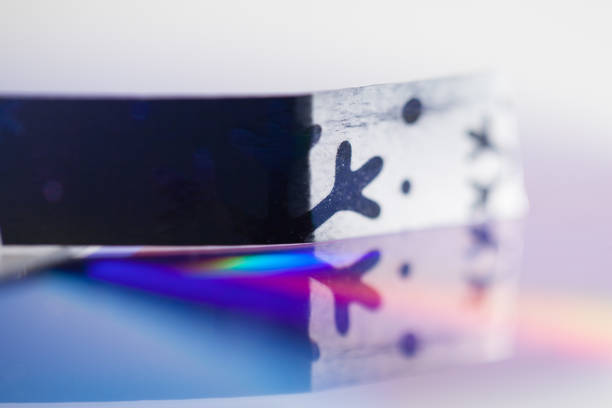 istock christmas ribbon with rainbow reflection 1070395108