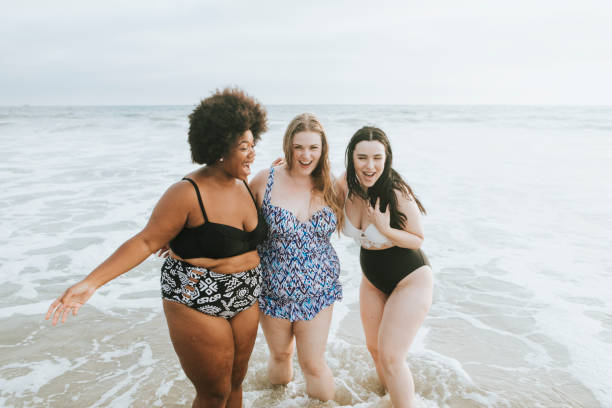 istock Gorgeous curvy women enjoying the beach 1070395172