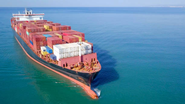 istock Large container ship at sea - Aerial image 1070398078