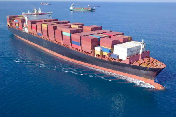 istock Large container ship at sea - Aerial image 1070398278