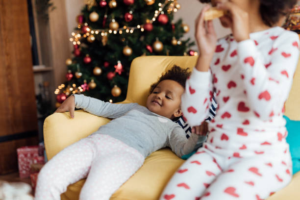 istock Cute sisters eating Christmas breakfast 1070399986