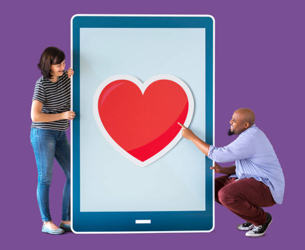 istock Diverse couple of people holding a tablet 1070400132