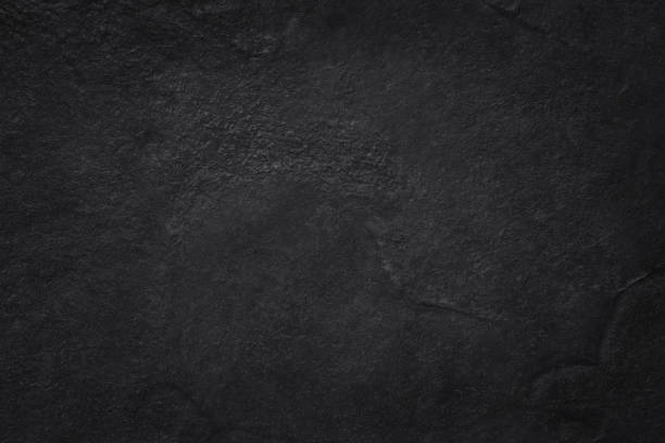 istock Dark grey black slate texture in natural pattern with high resolution for background and design art work. Black stone wall. 1070407194
