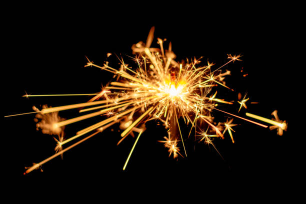 istock Christmas sparkler burning isolated on black background. 1070407876