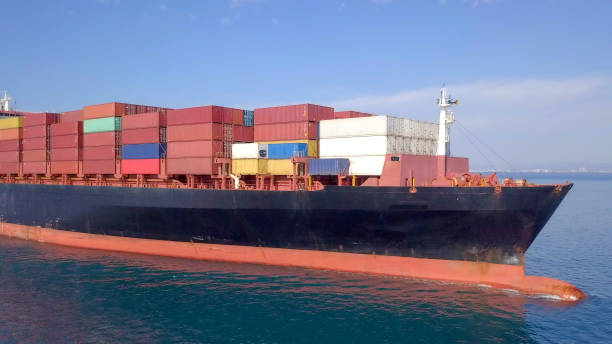 istock Large container ship at sea - Aerial image 1070408480