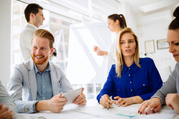 istock Group of business people working as team in office 1070410144