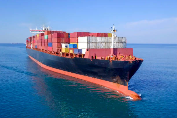 istock Large container ship at sea - Aerial image 1070410280