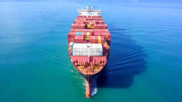 istock Large container ship at sea - Aerial image 1070410416