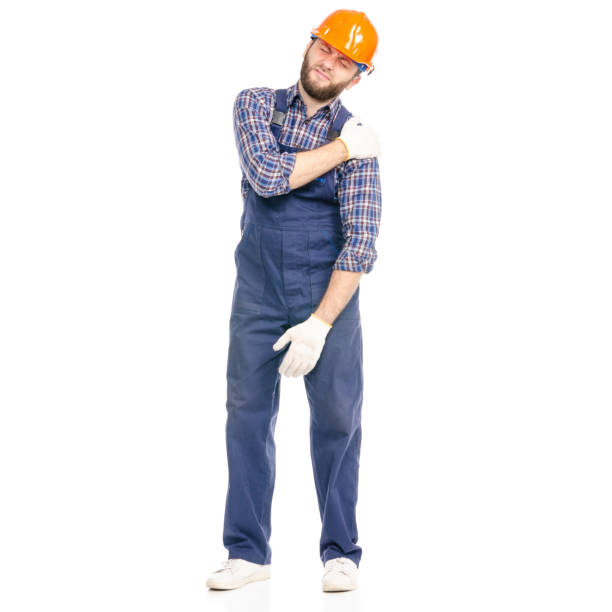 istock Young man builder industry worker hardhat pain hand 1070410916
