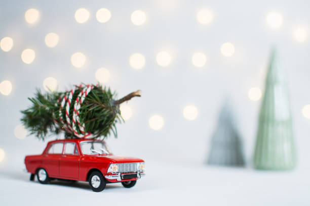 istock Red toy car with a christmas tree on the roof 1070411866