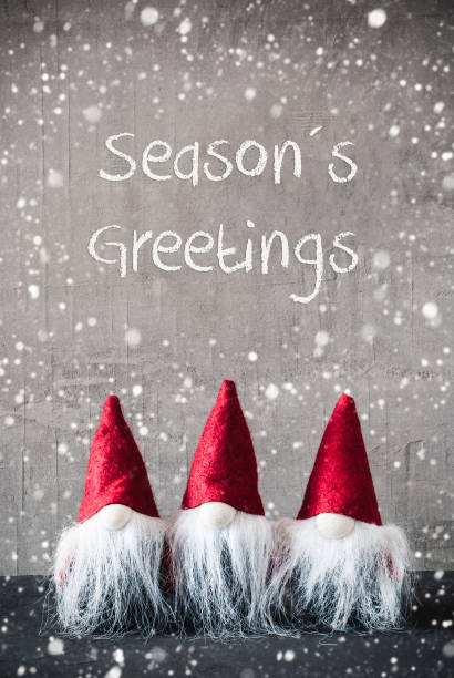 istock Three Red Gnomes, Cement, Snowflakes, Seasons Greetings 1070418948