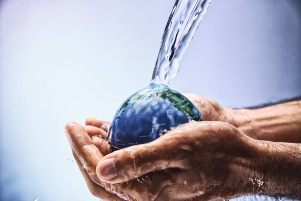 istock Water pouring on planet earth 1070422992