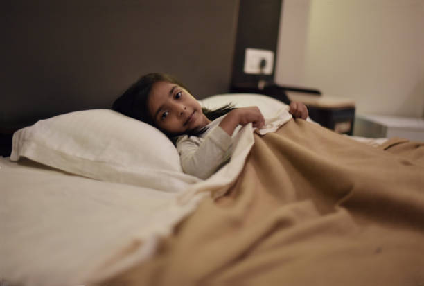 istock Young girl sleeping in the bed 1070432128