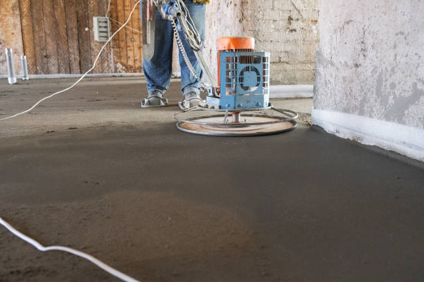 istock the workers grind the concrete floor at the construction site 1070440512