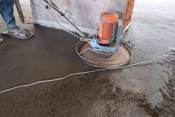 istock the workers grind the concrete floor at the construction site 1070441448