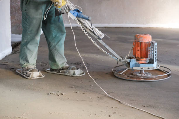 istock the workers grind the concrete floor at the construction site 1070441686