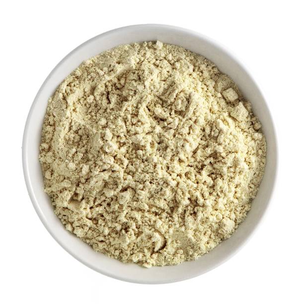 istock Protein powder in white bowl isolated on white background. Top view 1070457792