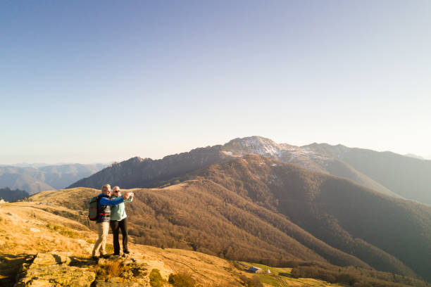 istock Hiking couple take selfie in mountains 1070460178