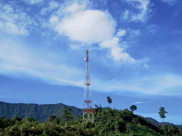 istock A common Communication tower for cellular connectivity over the blue sky and clouds. 1070465686