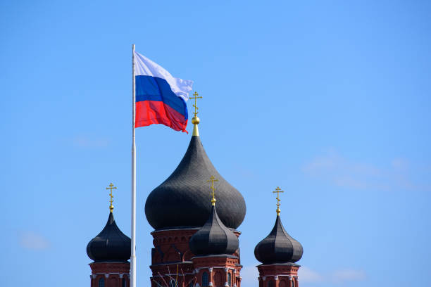 istock Russian flag fluttering next to church domes 1070468898