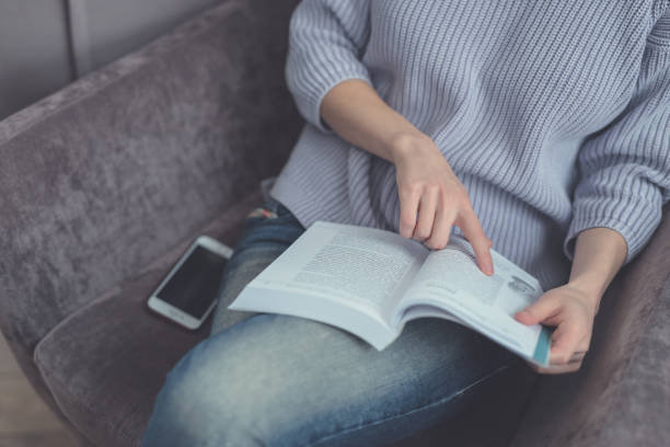 istock Young girl reading a book 1070469662
