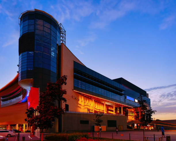 istock Modern shopping center building at night 1070474490