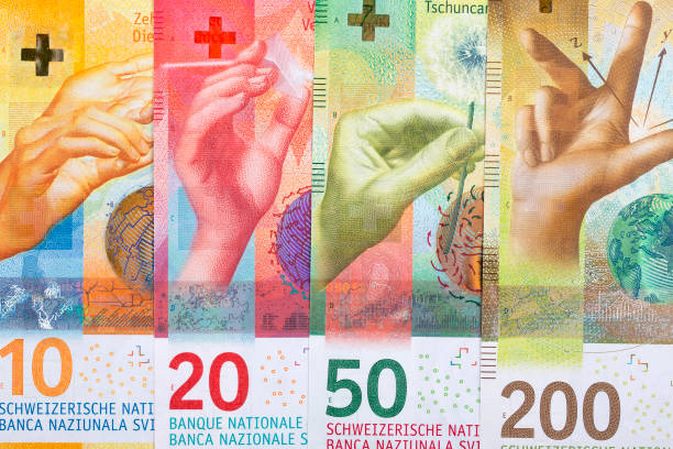 swiss money, a background - swiss currency franc sign switzerland currency imagens e fotografias de stock