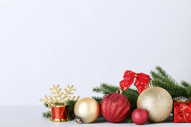 istock Christmas decorations with fir tree branches on gray background 1070492024