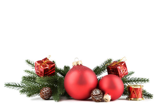 istock Christmas baubles with fir tree branches on white background 1070492560