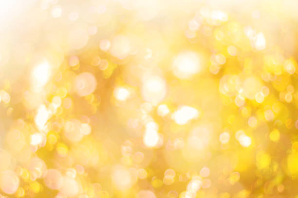 istock Abstract glamorous white silver and gold bokeh lights glitter sparkle. Defocused background have luxury golden color party invite for birthday, anniversary, holliday, new yearâs eve or Christmas. 1070497082