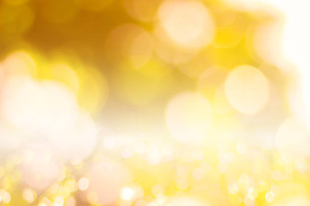 istock Abstract glamorous white silver and gold bokeh lights glitter sparkle. Defocused background have luxury golden color party invite for birthday, anniversary, holliday, new yearâs eve or Christmas. 1070497104