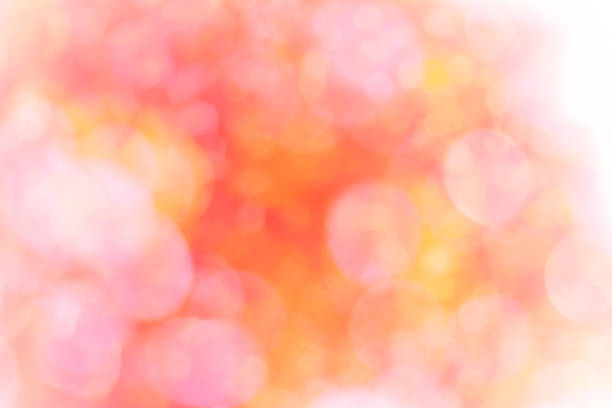 istock Abstract glamorous pink and orange bokeh lights glitter sparkle. Defocused background have luxury golden color party invite for birthday, anniversary, holliday, new year xmas or snow christmas blur. 1070497524