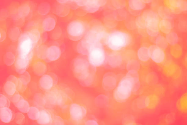 istock Abstract glamorous pink and orange bokeh lights glitter sparkle. Defocused background have luxury golden color party invite for birthday, anniversary, holliday, new year xmas or snow christmas blur. 1070497628