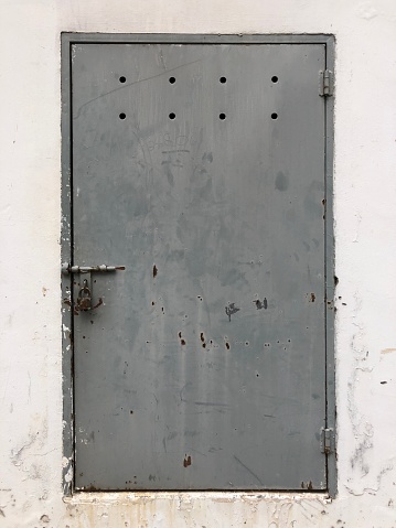 Front view of locked iron door.