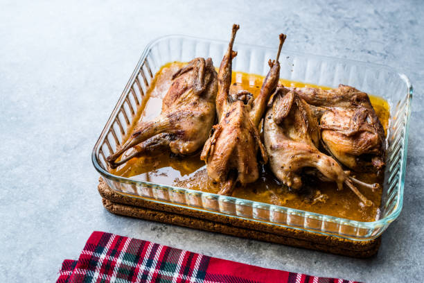 istock Roasted Crispy Quail Meat in Glass Bowl / Fried Small Chickens. 1070499592