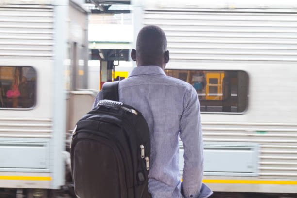 istock Male tourist waiting for a train 1070505850
