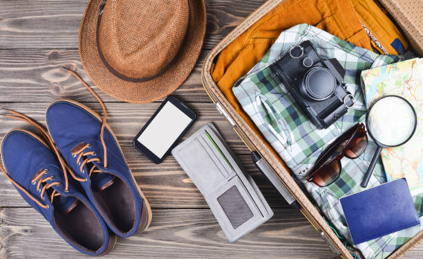 istock Open suitcase for travel with things and accessories 1070506292