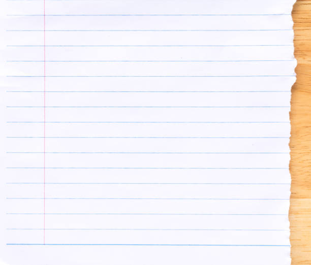 istock Notebook Lined Paper Background on wood desk 1070506736