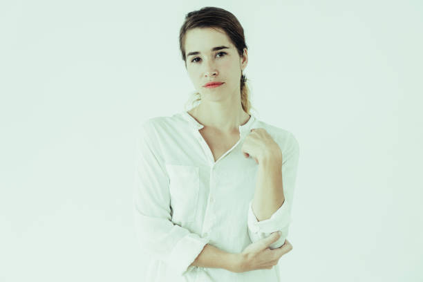 istock Relaxed pretty young woman looking at camera 1070507244