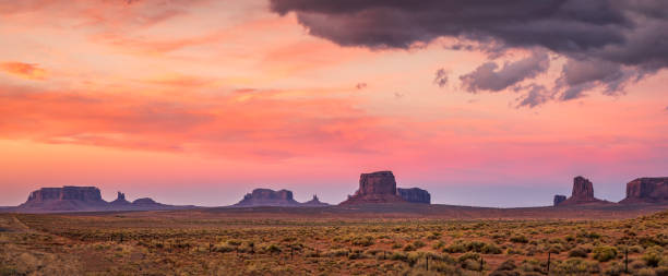 red sunset in monument valley. arizona. usa - monument valley usa panoramic imagens e fotografias de stock