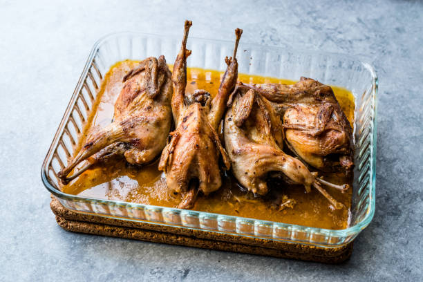 istock Roasted Crispy Quail Meat in Glass Bowl / Fried Small Chickens. 1070509182