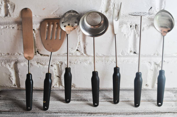 istock set of kitchen tools for cooking on a white wooden table. 1070511826