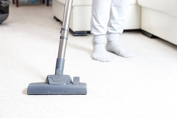 istock vacuum cleaner and woman 1070514794