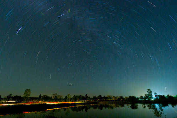 istock Night sky star trail over the pond 1070515846