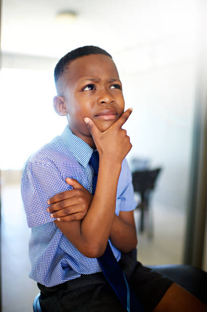 istock An African schoolboy contemplating indoors 1070518204