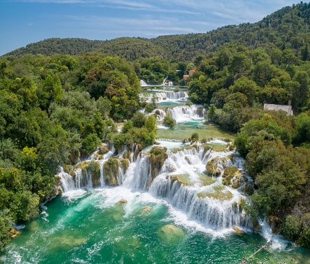 Aerial of the famous Krka staircase waterfalls with lots of tourists bathing at the beautiful Krka National Park, Croatia. Converted from RAW.