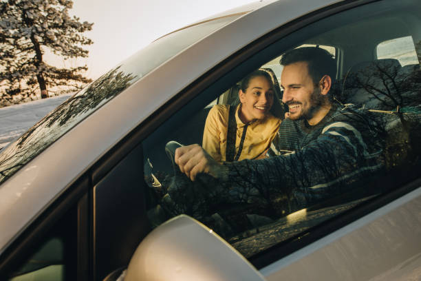 istock Young happy couple going on a road trip during winter day. 1070532540