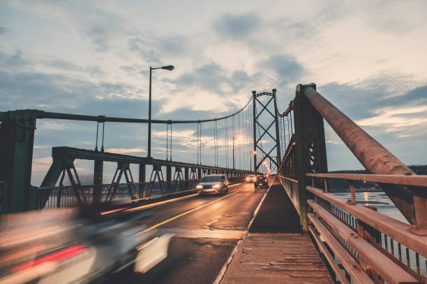 bridge view crossing saint lawrence river from ile d'orleans in quebec - lawrence quebec canada north america imagens e fotografias de stock