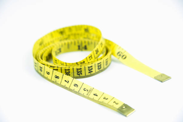 istock measuring tape on isolated white background 1070540052