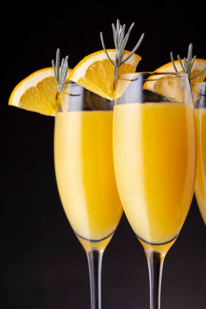 trzy koktajle mimozy w kieliszkach do szampana - lavender orange fruit table zdjęcia i obrazy z banku zdjęć